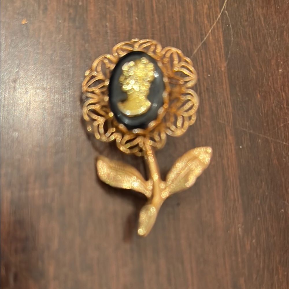 Intricate Gold and Black Flower Cameo Brooch